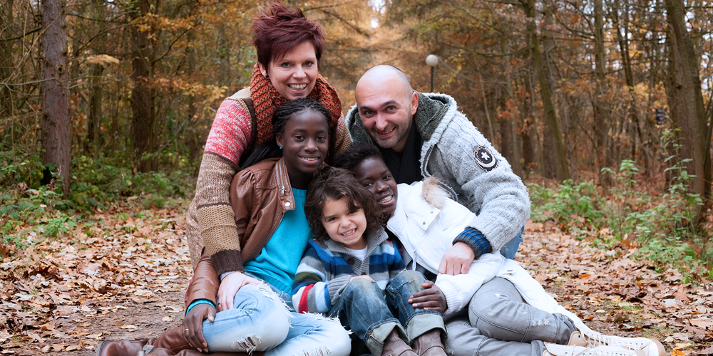family with foster care children in forest